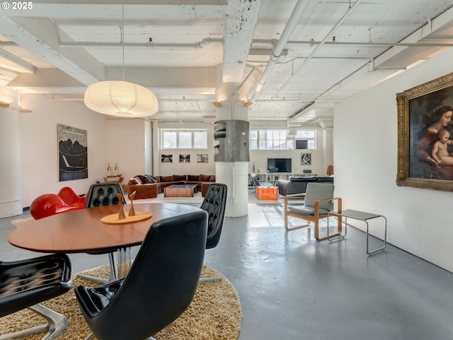 dining room featuring concrete floors