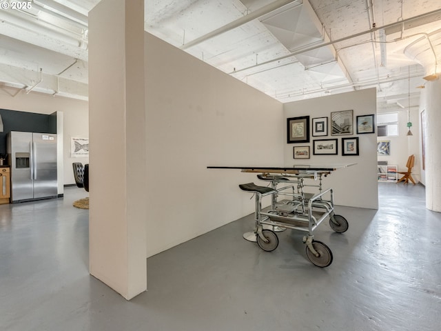 dining area featuring concrete floors