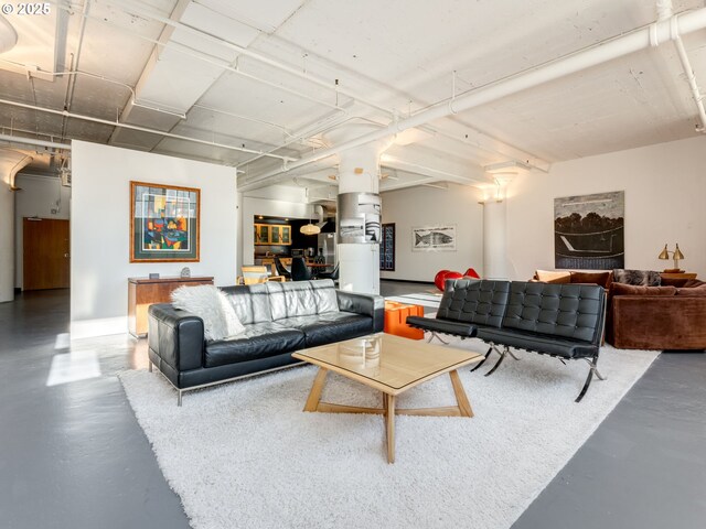 living room with concrete flooring