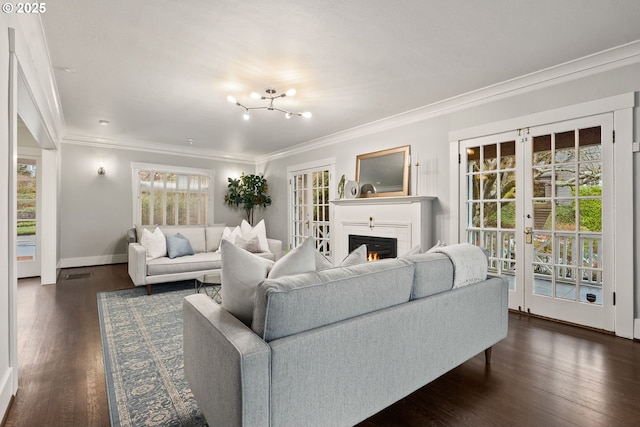 living room with french doors, ornamental molding, and dark hardwood / wood-style floors