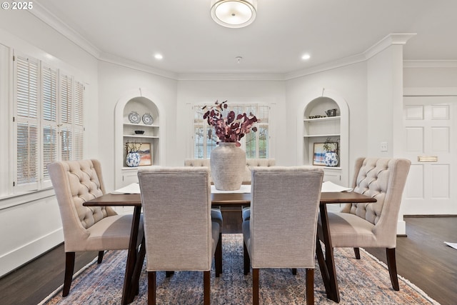 dining area featuring built in shelves, ornamental molding, and dark hardwood / wood-style floors