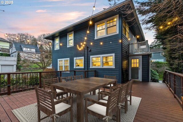 exterior space featuring a wooden deck and a balcony