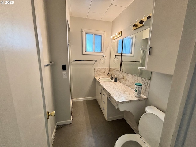 410 Division St, Elgin, OR 97827 - bathroom with baseboards, vanity, and toilet