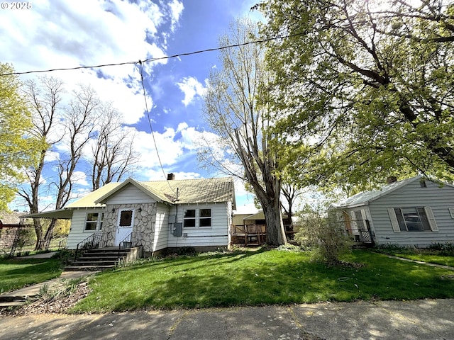 410 Division St, Elgin, OR 97827 - bungalow-style house featuring a chimney and a front yard
