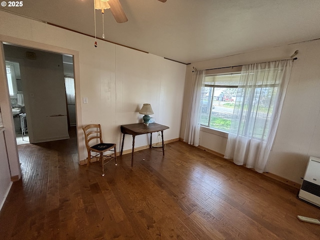 410 Division St, Elgin, OR 97827 - dining space with heating unit, baseboards, ceiling fan, and wood finished floors