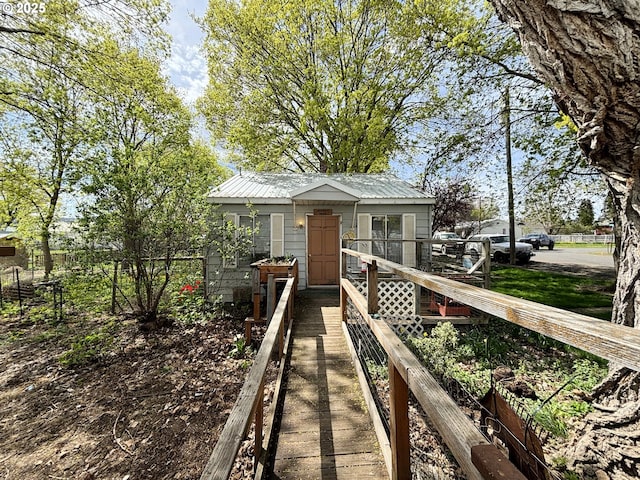 410 Division St, Elgin, OR 97827 - view of front of home featuring fence and metal roof