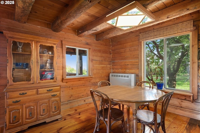 35912 Valley View Ln, Halfway, OR 97834 - dining space featuring wood ceiling with exposed beams, light wood finished floors, wood walls, and a skylight