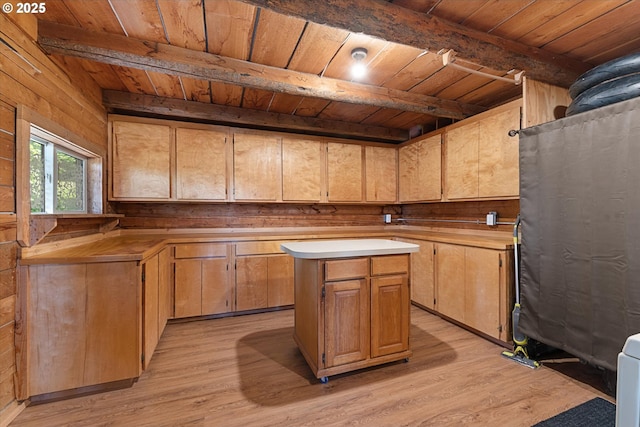 35912 Valley View Ln, Halfway, OR 97834 - kitchen featuring wooden ceiling with exposed beams, light wood finished floors, wood walls, a center island, and light countertops