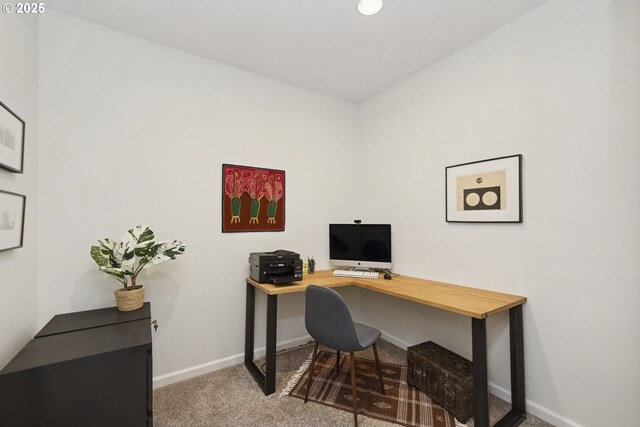 office space with baseboards and carpet flooring