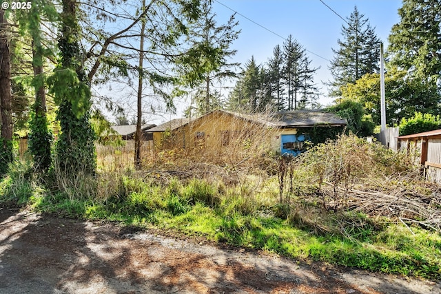 view of property exterior with fence