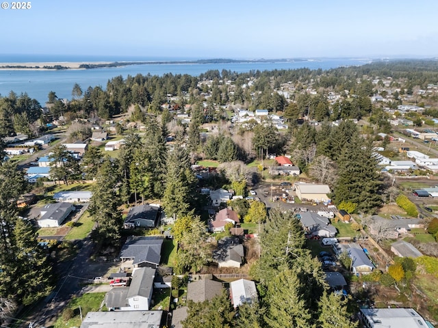 drone / aerial view featuring a water view and a residential view