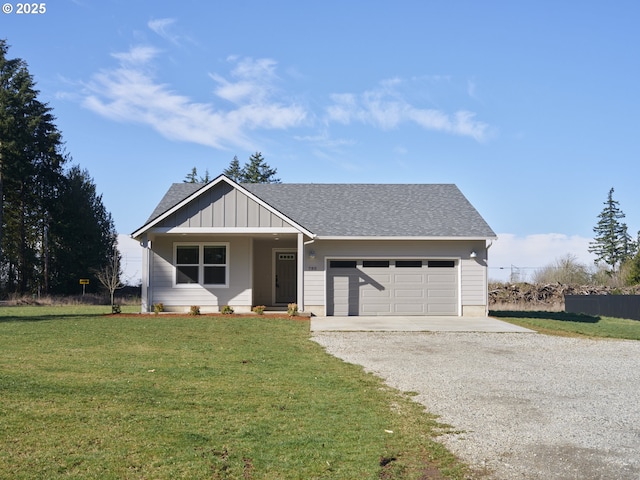 view of front of property with a garage, a shingled roof, driveway, a front lawn, and board and batten siding