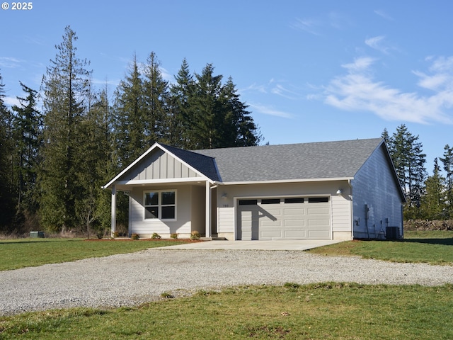 single story home featuring gravel driveway, an attached garage, board and batten siding, cooling unit, and a front lawn