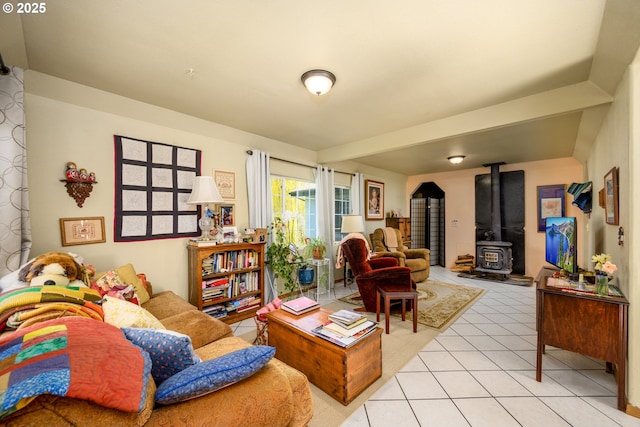 living room with light tile patterned flooring and a wood stove