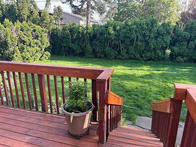 wooden deck with a yard