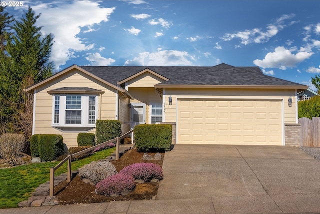 ranch-style home featuring a garage and concrete driveway