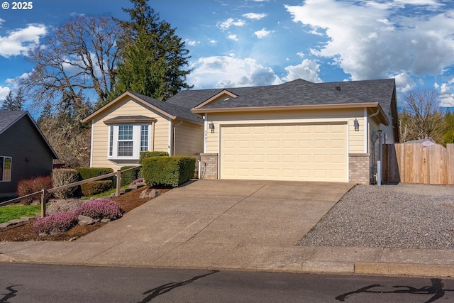 ranch-style home featuring a garage, brick siding, concrete driveway, and fence