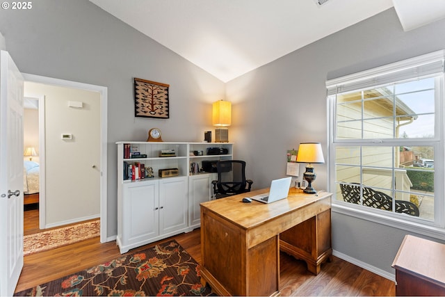 office featuring dark wood finished floors, baseboards, and vaulted ceiling