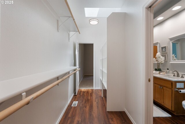 1225 NE 3rd Ave, Hillsboro, OR 97124 - hall featuring a skylight, dark wood finished floors, and recessed lighting