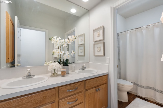 1225 NE 3rd Ave, Hillsboro, OR 97124 - full bathroom featuring double vanity, wood finished floors, recessed lighting, and a shower with curtain