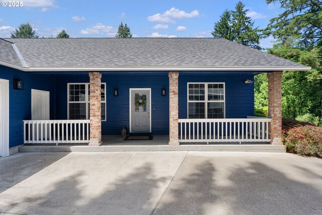1225 NE 3rd Ave, Hillsboro, OR 97124 - view of front of property with a porch and roof with shingles