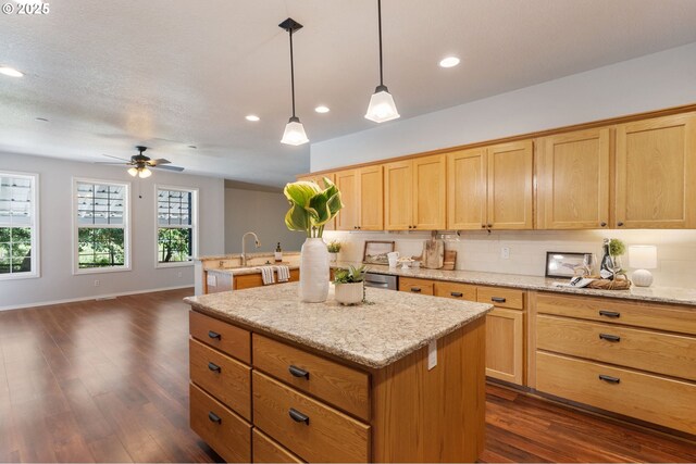 1225 NE 3rd Ave, Hillsboro, OR 97124 - kitchen featuring a kitchen island, ceiling fan, dark wood-style flooring, recessed lighting, and decorative light fixtures