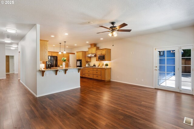 1225 NE 3rd Ave, Hillsboro, OR 97124 - unfurnished living room featuring ceiling fan, dark wood-style flooring, a textured ceiling, and recessed lighting