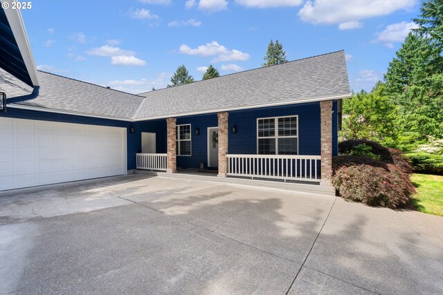 1225 NE 3rd Ave, Hillsboro, OR 97124 - ranch-style house with roof with shingles, a porch, concrete driveway, and an attached garage