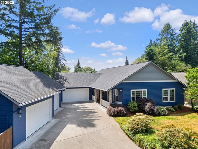1225 NE 3rd Ave, Hillsboro, OR 97124 - view of front of house featuring a garage, driveway, and roof with shingles