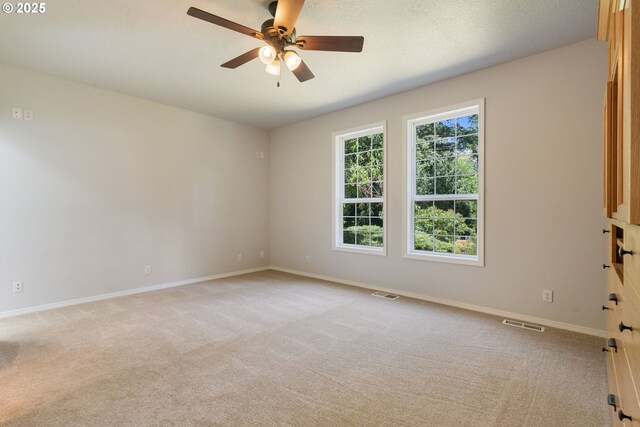 1225 NE 3rd Ave, Hillsboro, OR 97124 - unfurnished room featuring light carpet and a ceiling fan