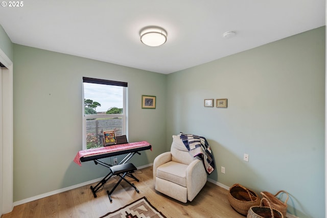 sitting room with light wood-type flooring