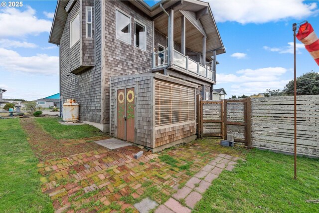 view of side of home with a balcony