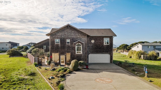 view of front facade featuring a front lawn and a garage