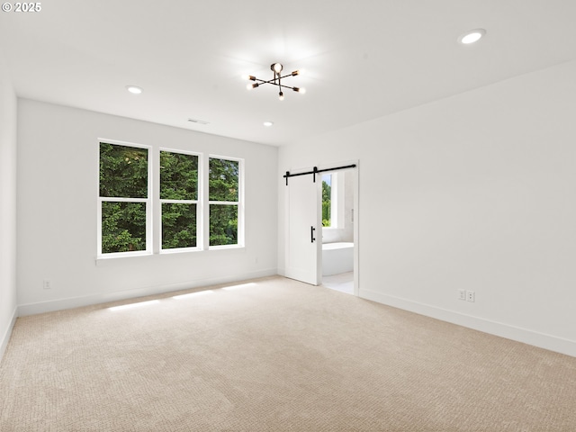 6715 NE 132nd St, Vancouver, WA 98686 - unfurnished room featuring light carpet, a barn door, baseboards, and recessed lighting