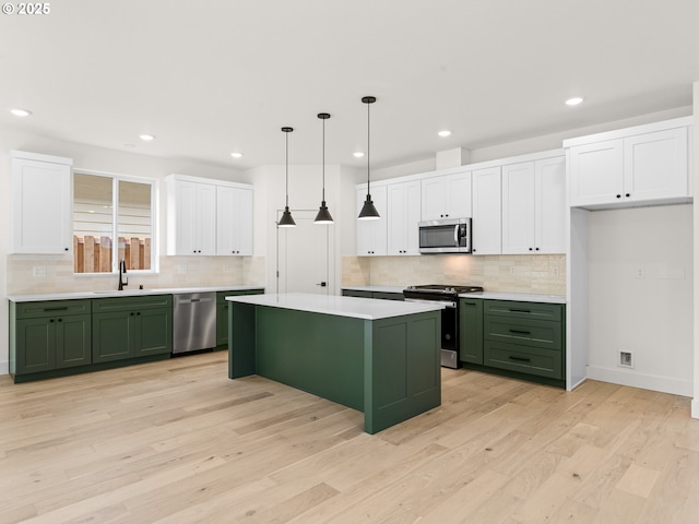 6715 NE 132nd St, Vancouver, WA 98686 - kitchen featuring green cabinetry, stainless steel appliances, white cabinets, and recessed lighting