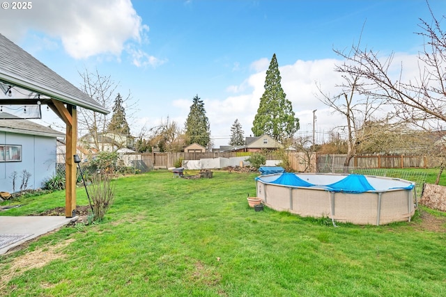 view of yard with a fenced backyard and a fenced in pool