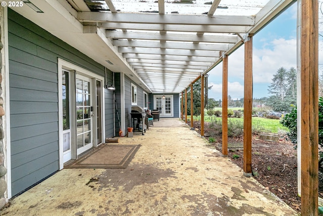 view of patio / terrace featuring grilling area, a pergola, and french doors