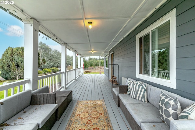 deck featuring a porch and an outdoor living space