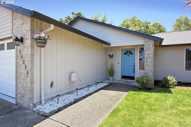 18294 SW Bergs Ct, Beaverton, OR 97003 - property entrance featuring an attached garage and a lawn