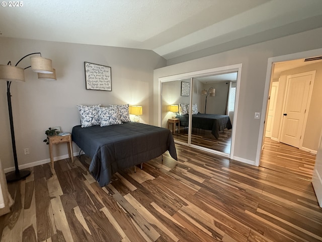 18294 SW Bergs Ct, Beaverton, OR 97003 - bedroom featuring wood finished floors, lofted ceiling, baseboards, and a closet