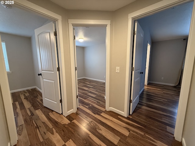 18294 SW Bergs Ct, Beaverton, OR 97003 - hall with dark wood-style floors and baseboards