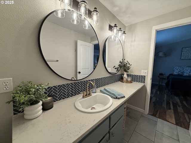 18294 SW Bergs Ct, Beaverton, OR 97003 - bathroom with vanity, decorative backsplash, and tile patterned flooring