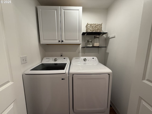 18294 SW Bergs Ct, Beaverton, OR 97003 - washroom with cabinet space and washer and clothes dryer
