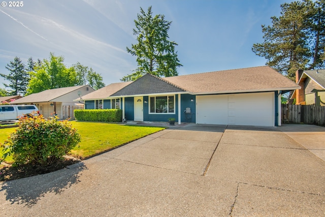 single story home with concrete driveway, a garage, and a shingled roof