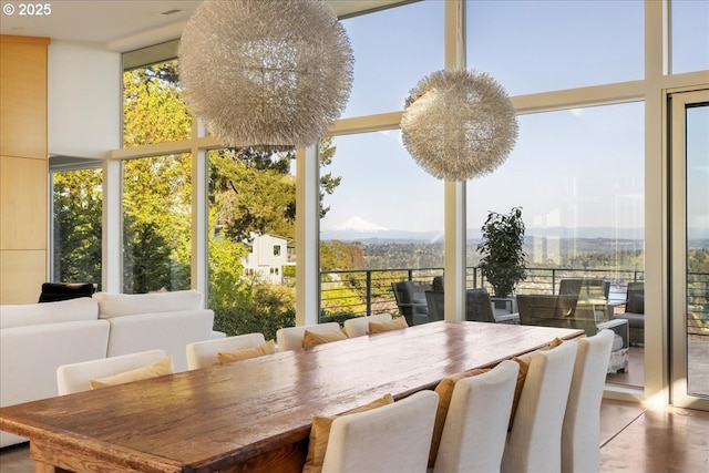 sunroom with floor to ceiling windows and a wealth of natural light