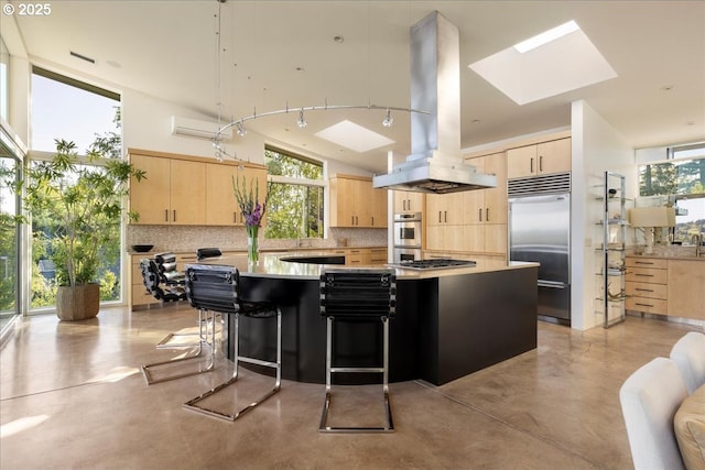 1900 Crest Dr, Lake Oswego, OR 97034 - kitchen featuring light brown cabinets, stainless steel appliances, island exhaust hood, a skylight, and finished concrete flooring