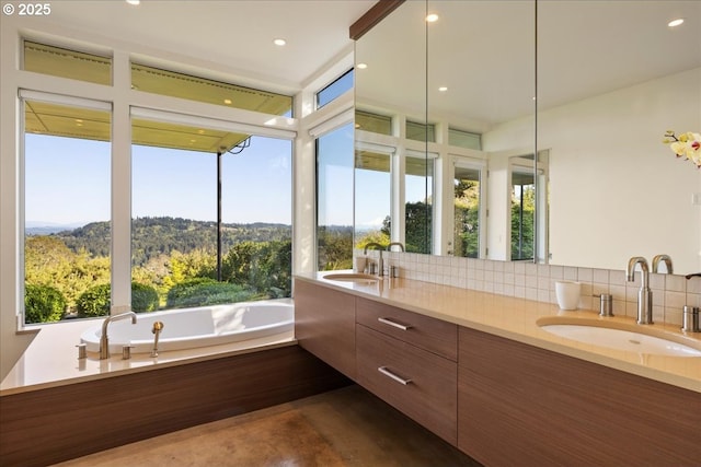 1900 Crest Dr, Lake Oswego, OR 97034 - full bath with healthy amount of natural light, double vanity, decorative backsplash, a garden tub, and recessed lighting