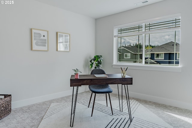 office area featuring baseboards, visible vents, and carpet flooring