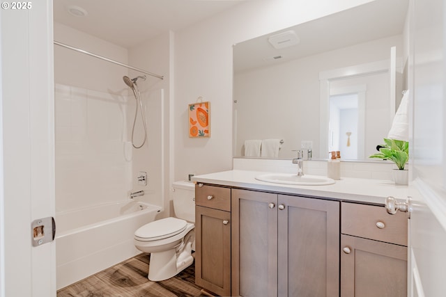 full bathroom with wood finished floors, vanity, toilet, and shower / bath combination