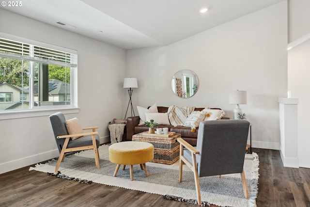 living area featuring wood finished floors, recessed lighting, and baseboards